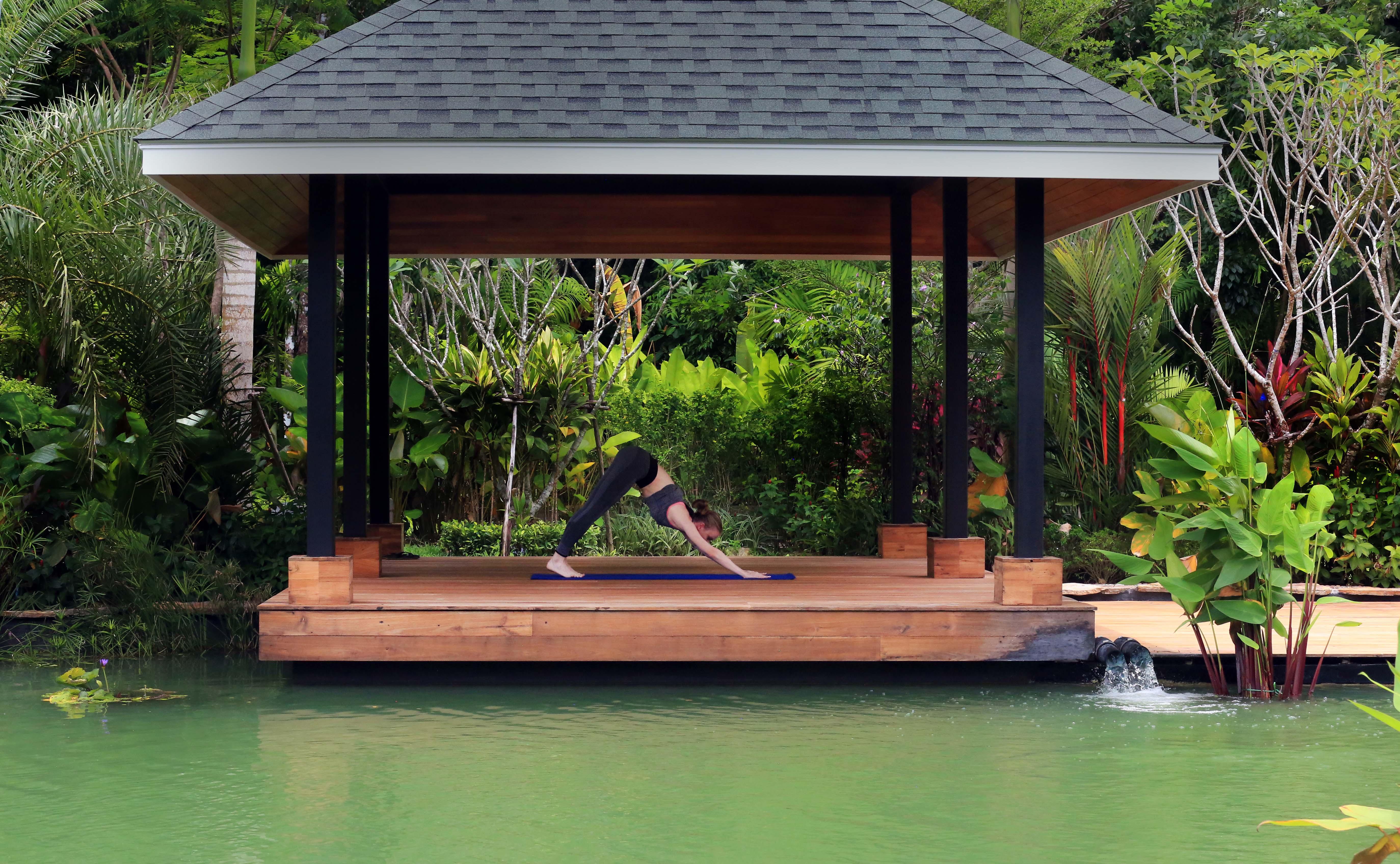 The Pavilions Phuket (Adults Only) Bang Tao Beach  Zewnętrze zdjęcie A woman practicing yoga at the BANYAN TREE Spa